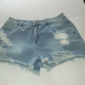 3xl Distressed, light wash jean shorts.